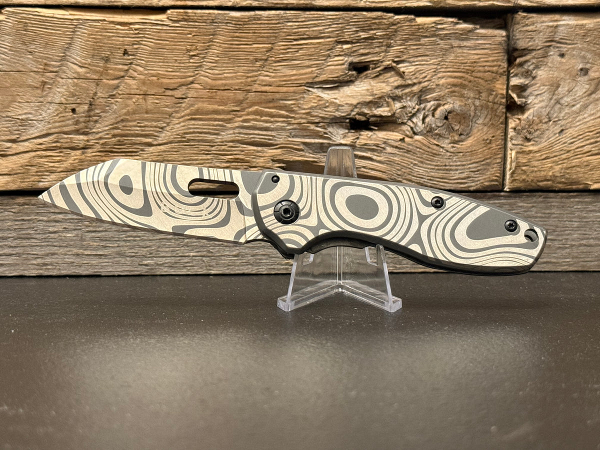 Custom Engraved Buck Knife w/ Damascus Steel Pattern – Blade of Resilience