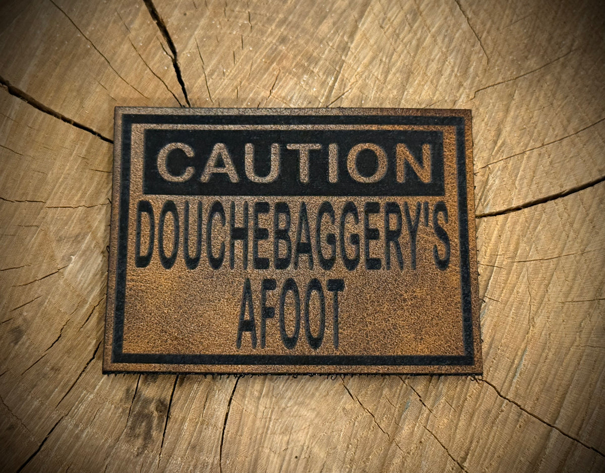 Caution: Douchebaggery’s Afoot Leatherette Morale Patch – Velcro-Backed Warning Sign